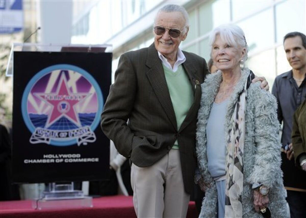 Comic book creator Stan Lee poses with his wife Joan after he received a star on the Hollywood Walk of Fame in Los Angeles, Tuesday, Jan. 4, 2011. (AP Photo/Chris Pizzello)