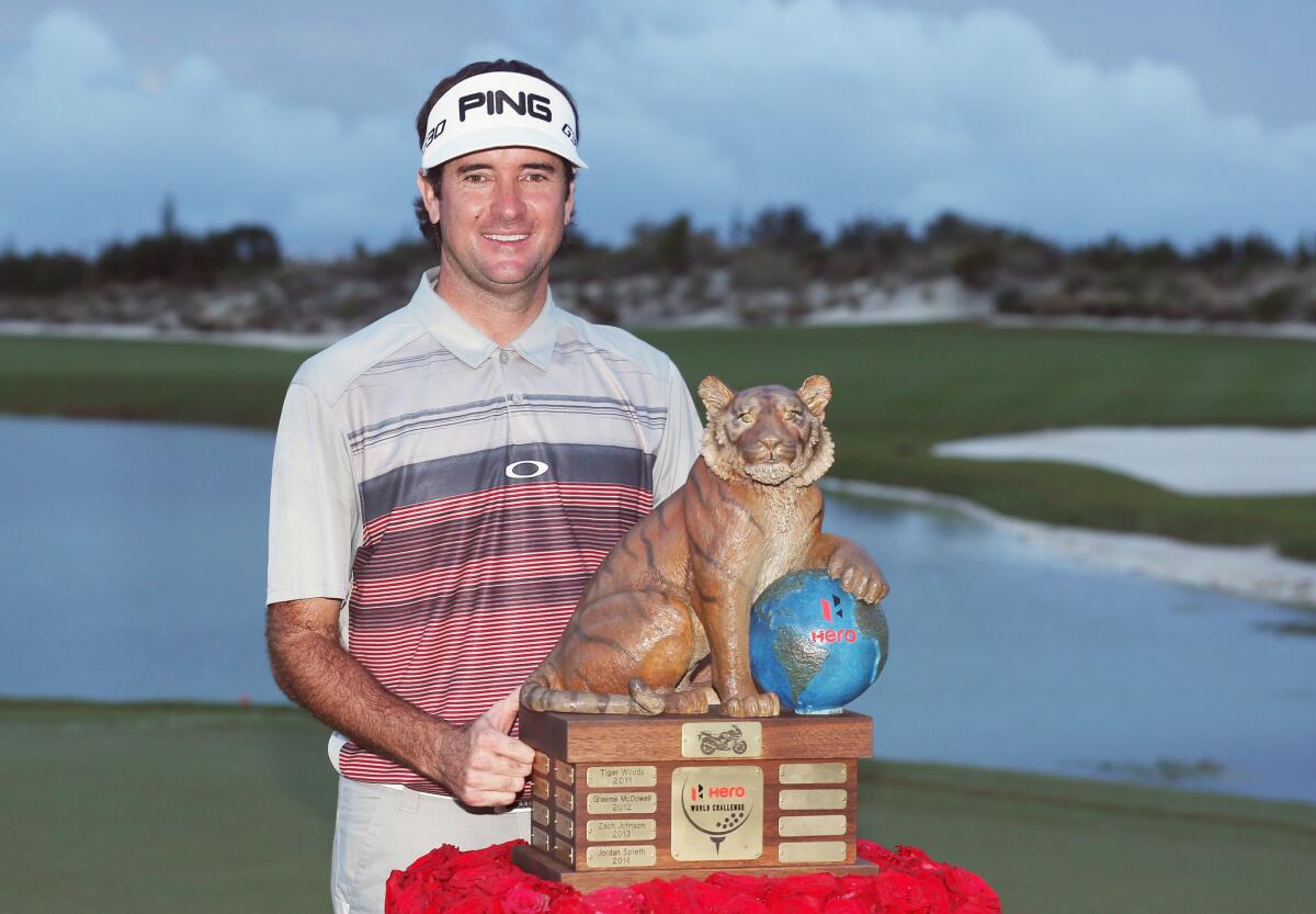 Bubba Watson poses with the trophy after his three-stroke victory at the Hero World Challenge in Nassau, Bahamas.