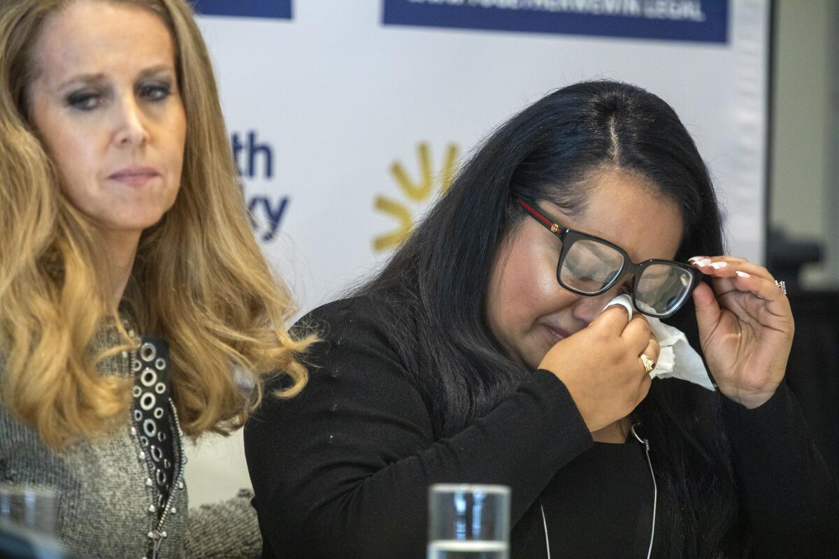 Attorney Jennifer J. McGrath, left, and Gabby speak during a press conference at Luxe Sunset Boulevard Hotel, on Tuesday.