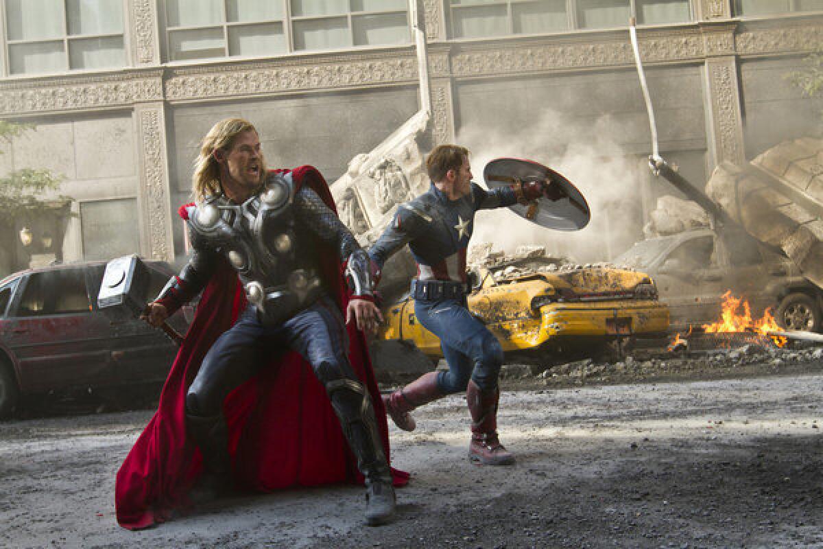 Chris Hemsworth portrays Thor, left, and Chris Evans portrays Capt. America in a scene from "The Avengers," one of the hit films of 2012.