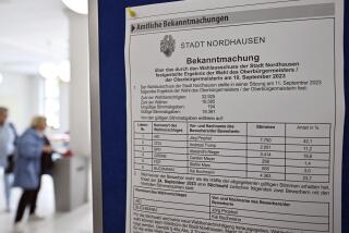 A view of the absentee ballot office with a list of mayoral candidates, in Nordhausen town hall, Nordhausen, Germany, Tuesday, Sept. 19, 2023. The German city of Nordhausen is best known as the location of the former Nazi concentration camp Mittelbau-Dora. A mayoral election on Sunday, Sept, 24, 2023 could again put the focus on the municipality of 42,000 people if a far-right candidate wins the vote. (Martin Schutt/dpa via AP)