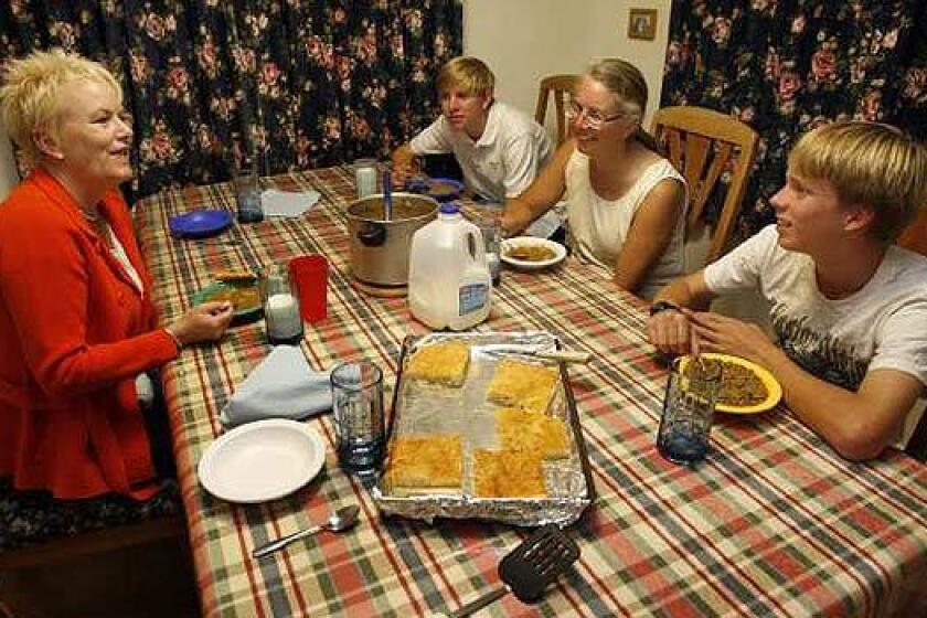 Registered dietitian Lisa Gibson (left) joins the Noble family for dinner: Kristy Noble (2nd from right) and her sons Scott Noble (right), 14 and Robert Noble (2nd from left), 17 in the Nobles' home in Mission Viejo on Oct, 30 2009.