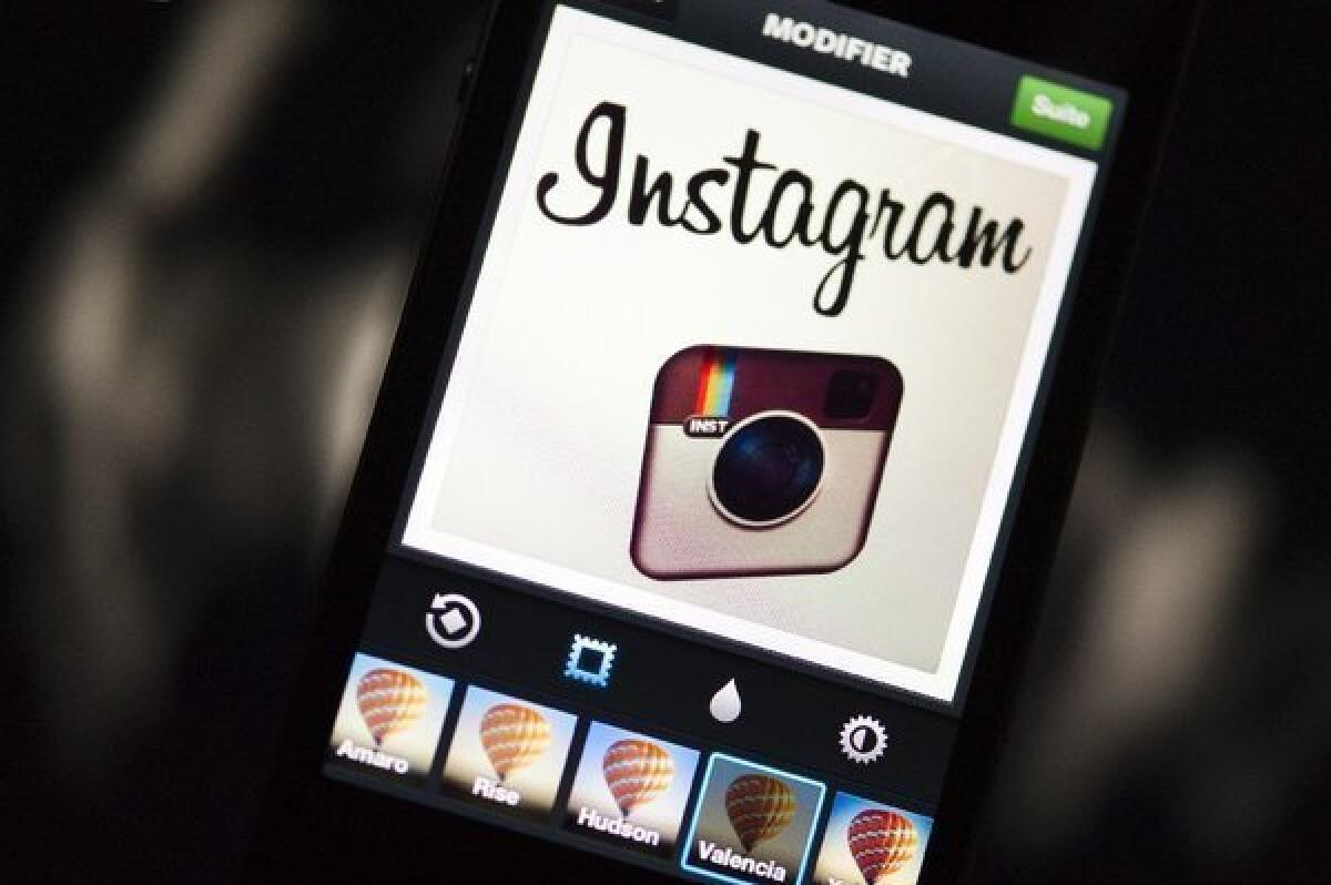 The Instagram logo is displayed on a smartphone.