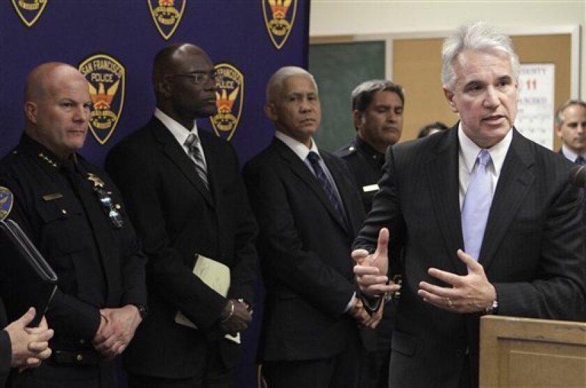 San Francisco District Attorney George Gascon, right, speaks during a news conference regarding the arrests of suspects in the killing of German tourist Mechthild Schröer at the Hall of Justice in San Francisco, Wednesday, May 4, 2011. Also pictured is San Francisco Police Chief Greg Suhr, left. (AP Photo/Jeff Chiu)