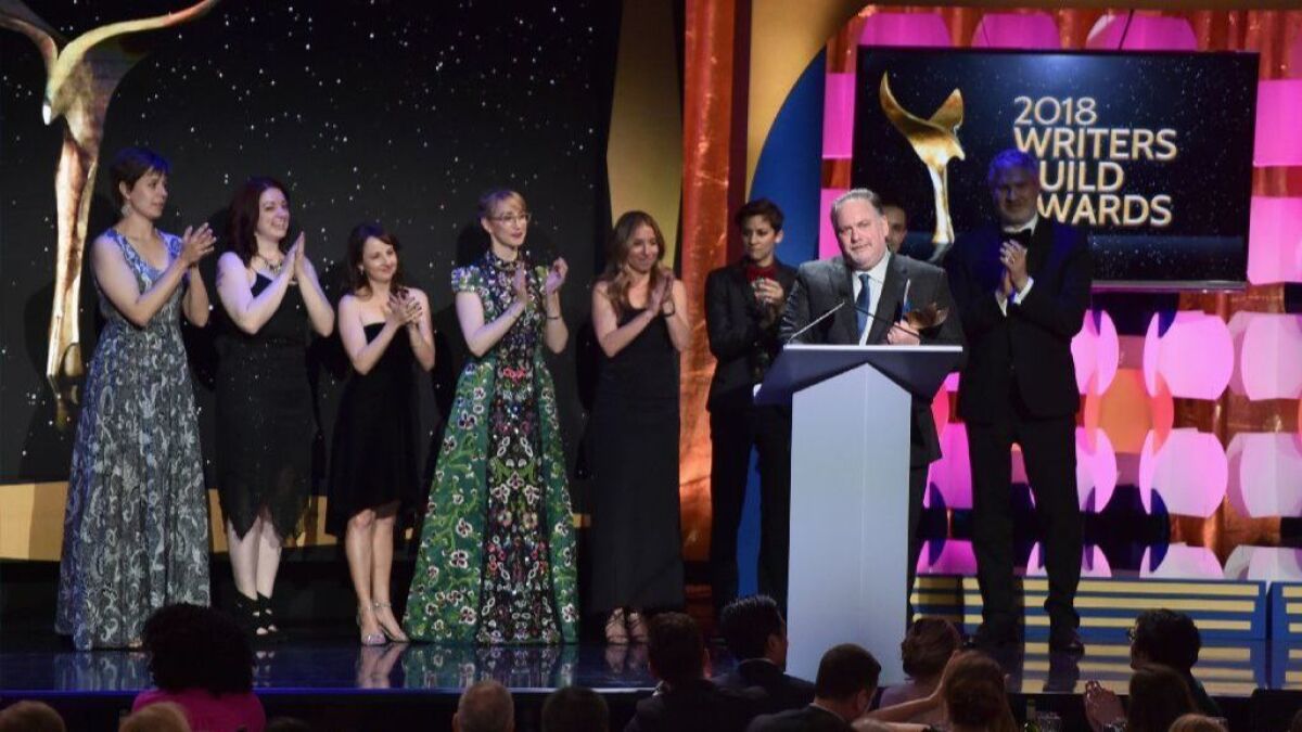 Writer-producer Bruce Miller and the writers of "The Handmaid's Tale" accept the drama series award at the Writers Guild Awards ceremony in Beverly Hills on Feb. 11..