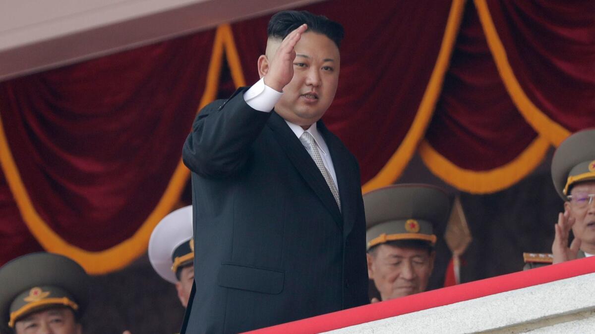 North Korean leader Kim Jong Un waves during a military parade in Pyongyang, North Korea to celebrate the 105th birth anniversary of Kim Il Sung on April 15.