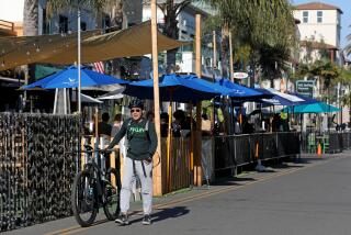 HUNTINGTON BEACH, CA - JANUARY 14: Outside seating for restaurants still open for business along Main Street in downtown on Thursday, Jan. 14, 2021 in Huntington Beach, CA. Many restaurants along Main St. are staying open during COVID-19 restrictions. (Gary Coronado / Los Angeles Times)