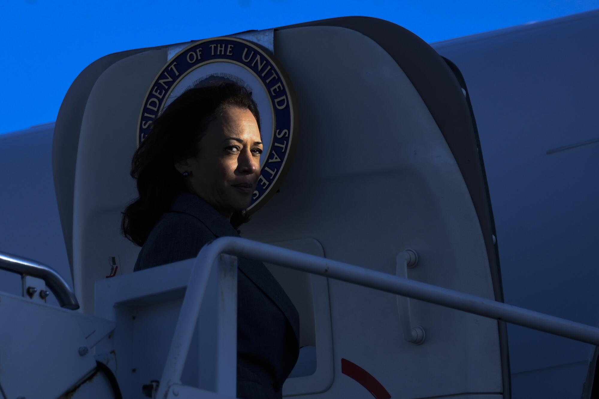 Vice President Kamala Harris boards an airplane.