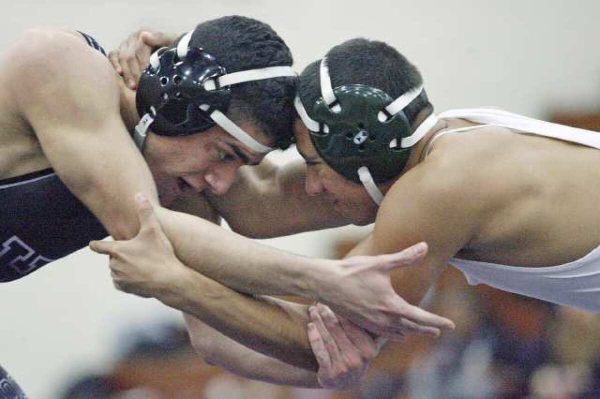 Hoover's Andres Rosas, left, wrestles Monrovia's Christian Valenzuela.