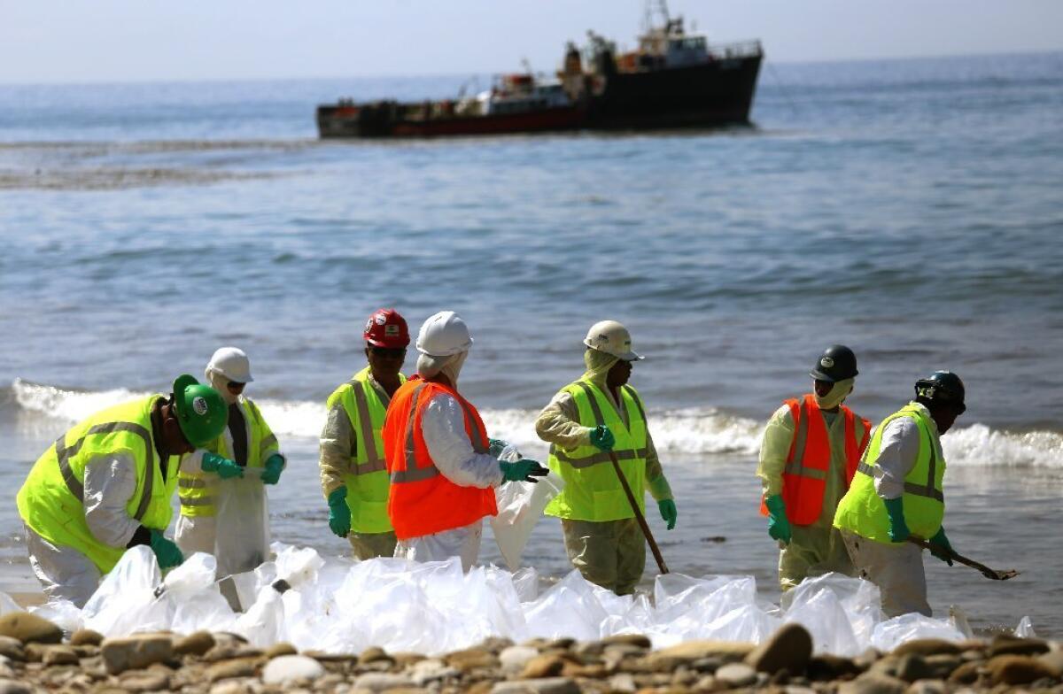 Workers continue to clean the shoreline at Refugio State Beach in Santa Barbara County after a crude oil pipeline ruptured on May 19, spilling thousands of gallons into the ocean.