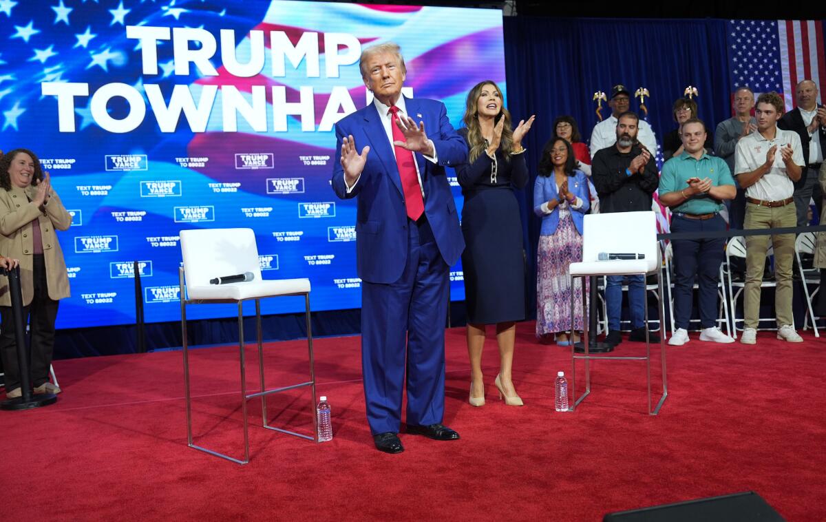 Former President Trump stands on stage during a town hall in which he spent about 30 minutes listening to music on Oct. 14. 