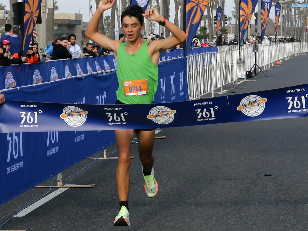 Robert Miranda of Venice wins the men's Surf City Half Marathon on Sunday.