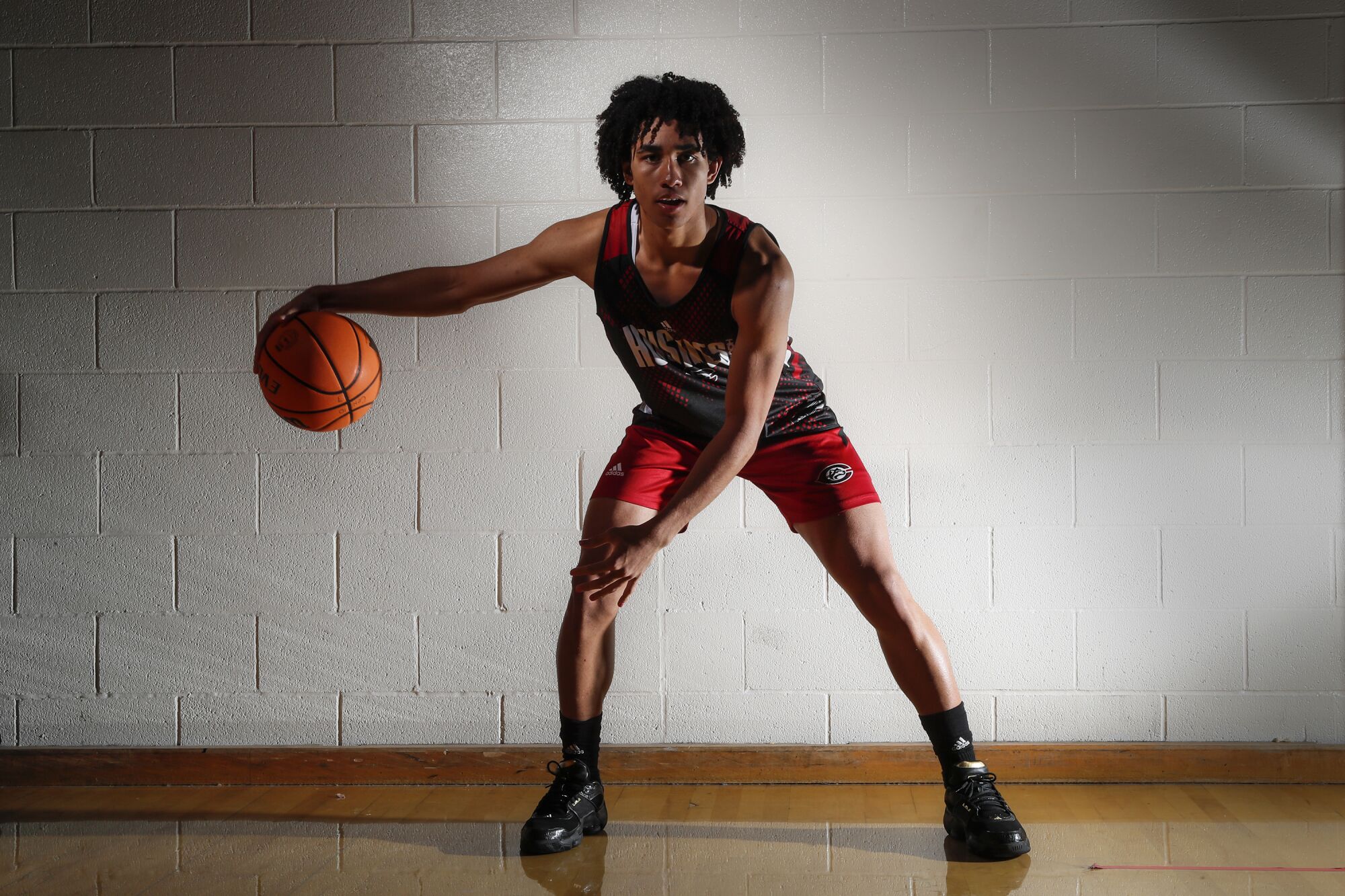 Centennial High guard Jared McCain poses for a photo at practice.