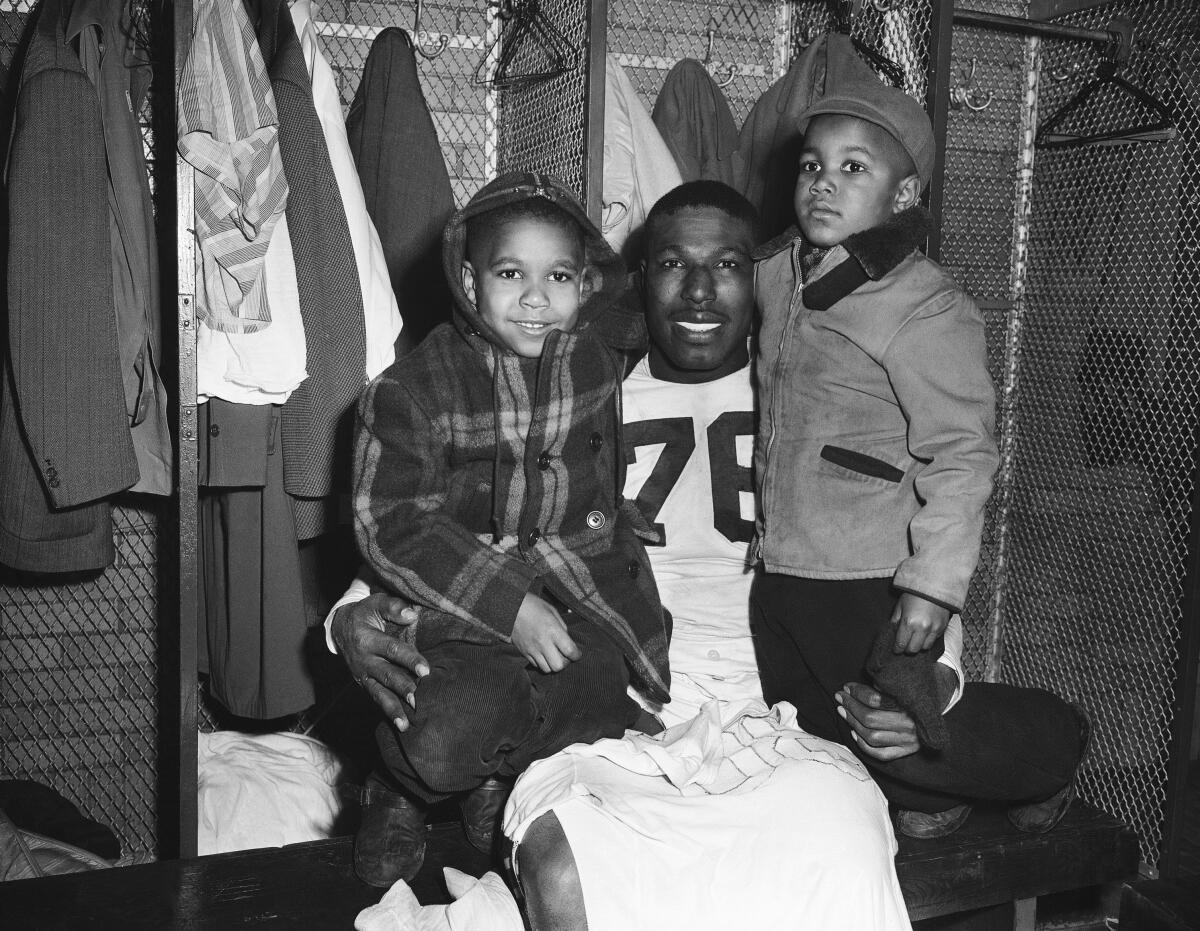 Cleveland Browns fullback Marion Motley with his two sons Ronald and Raymond
