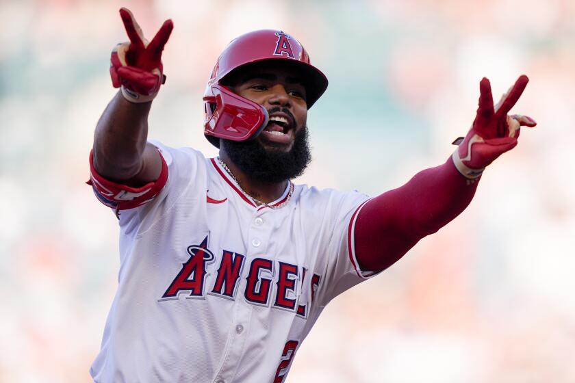 Los Angeles Angels' Luis Rengifo gestures while running the bases on a two-run home run.