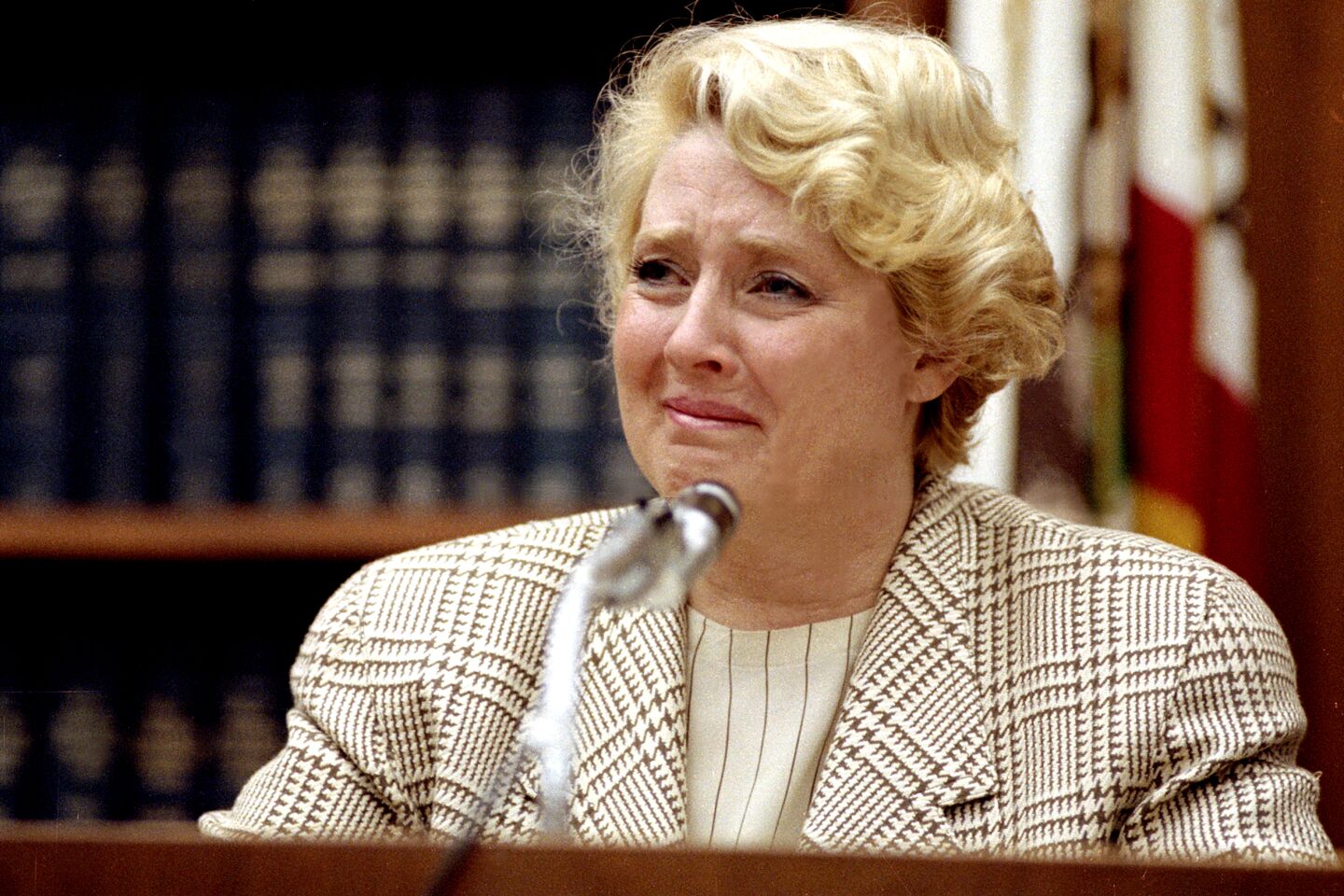 Broderick fights back tears while answering questions from defense attorney Jack Earley on Oct. 30, 1990.
