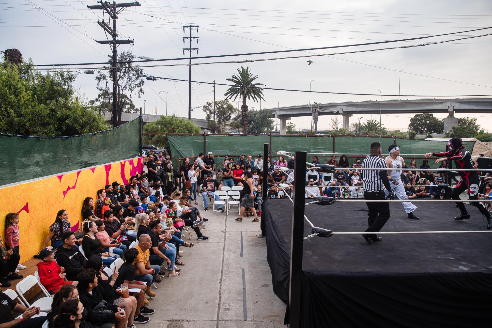 Incendio Calavera (right) and Eddie Islas (left) in the ring during the Baja Stars USA Lucha Libre event in Logan Heights.
