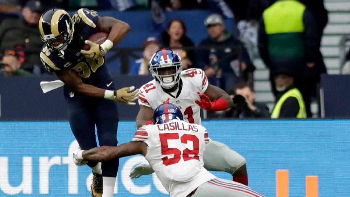 Rams running back Todd Gurley evades a tackle from Giants linebacker Jonathan Casillas during a game on Oct. 23.