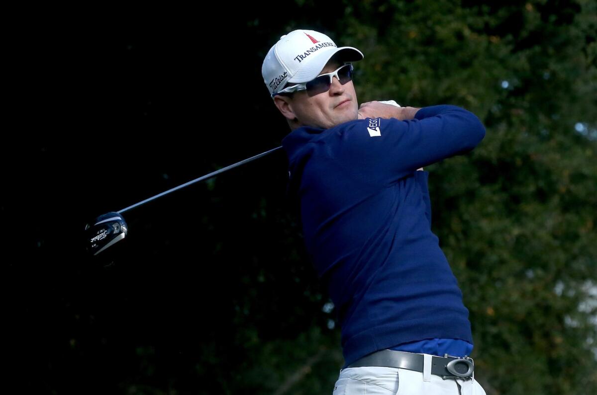 Zach Johnson watches his tee shot on the sixth hole during the opening round of the Northwestern Mutual World Challenge at Sherwood Country Club in Thousand Oaks on Thursday.