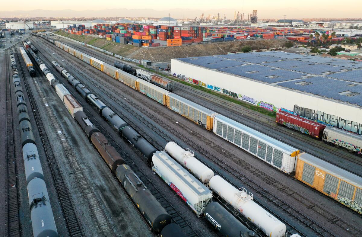 Freight cars sit in a rail yard.