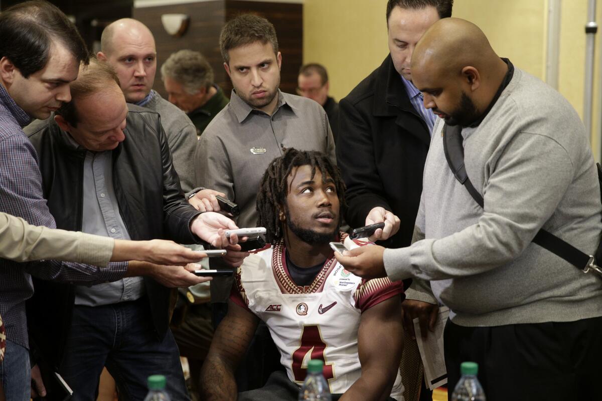 Florida State running back Dalvin Cook, center, is surrounded by reporters during a Rose Bowl media day in January.