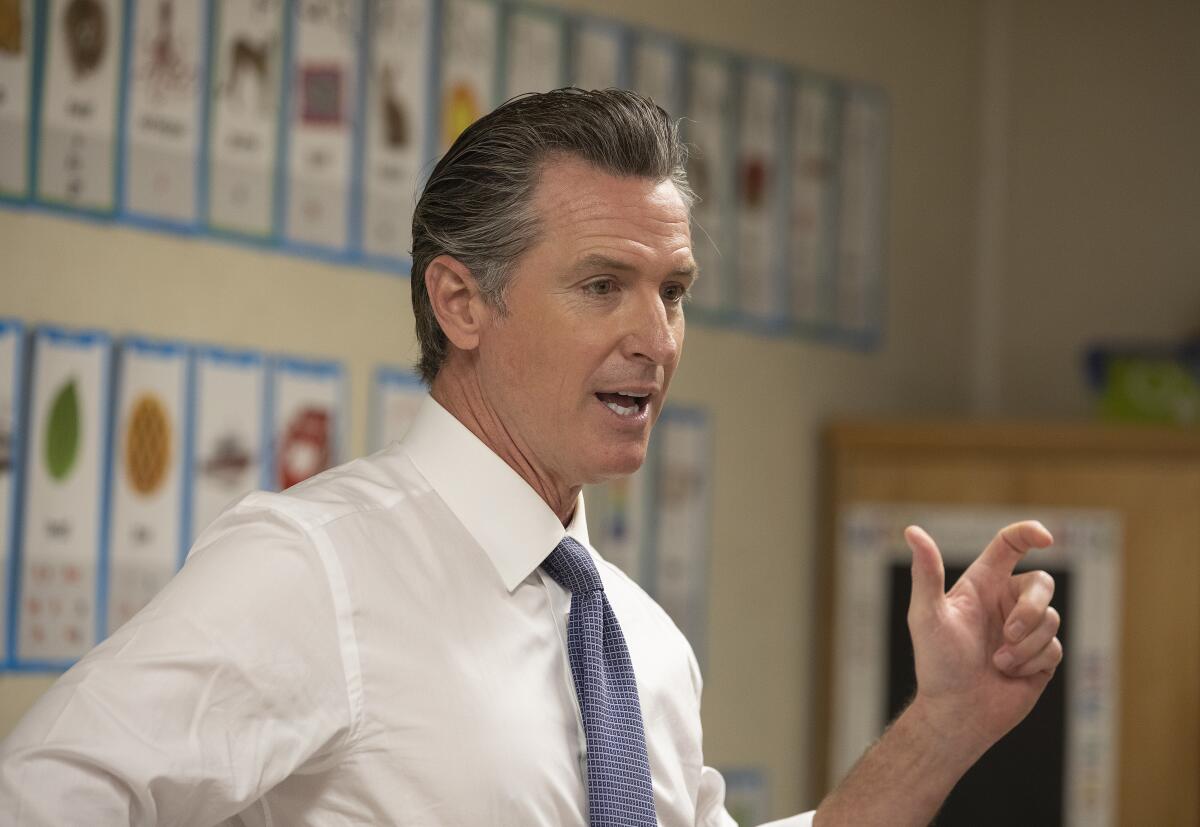 Gov. Gavin Newsom speaks to reporters in North Hollywood.