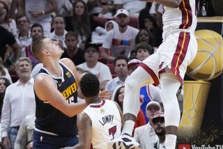 Miami Heat center Bam Adebayo (13) dunks the ball during the first half of Game 4 of the basketball NBA Finals against the Denver Nuggets, Friday, June 9, 2023, in Miami. (AP Photo/Wilfredo Lee)