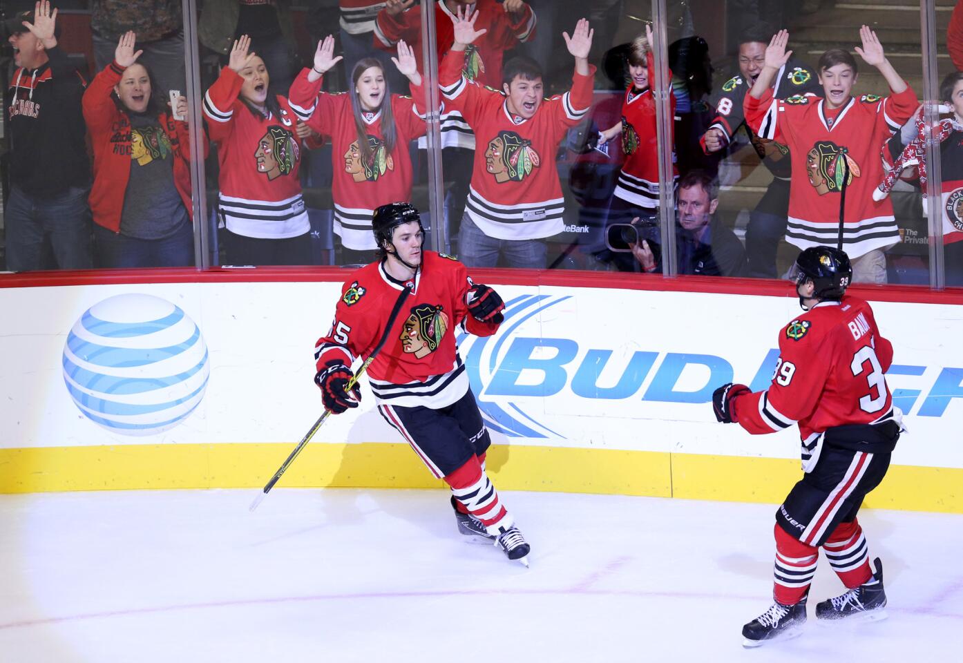 Blackhawks fans cheer after a goal by Andrew Shaw in the third period.