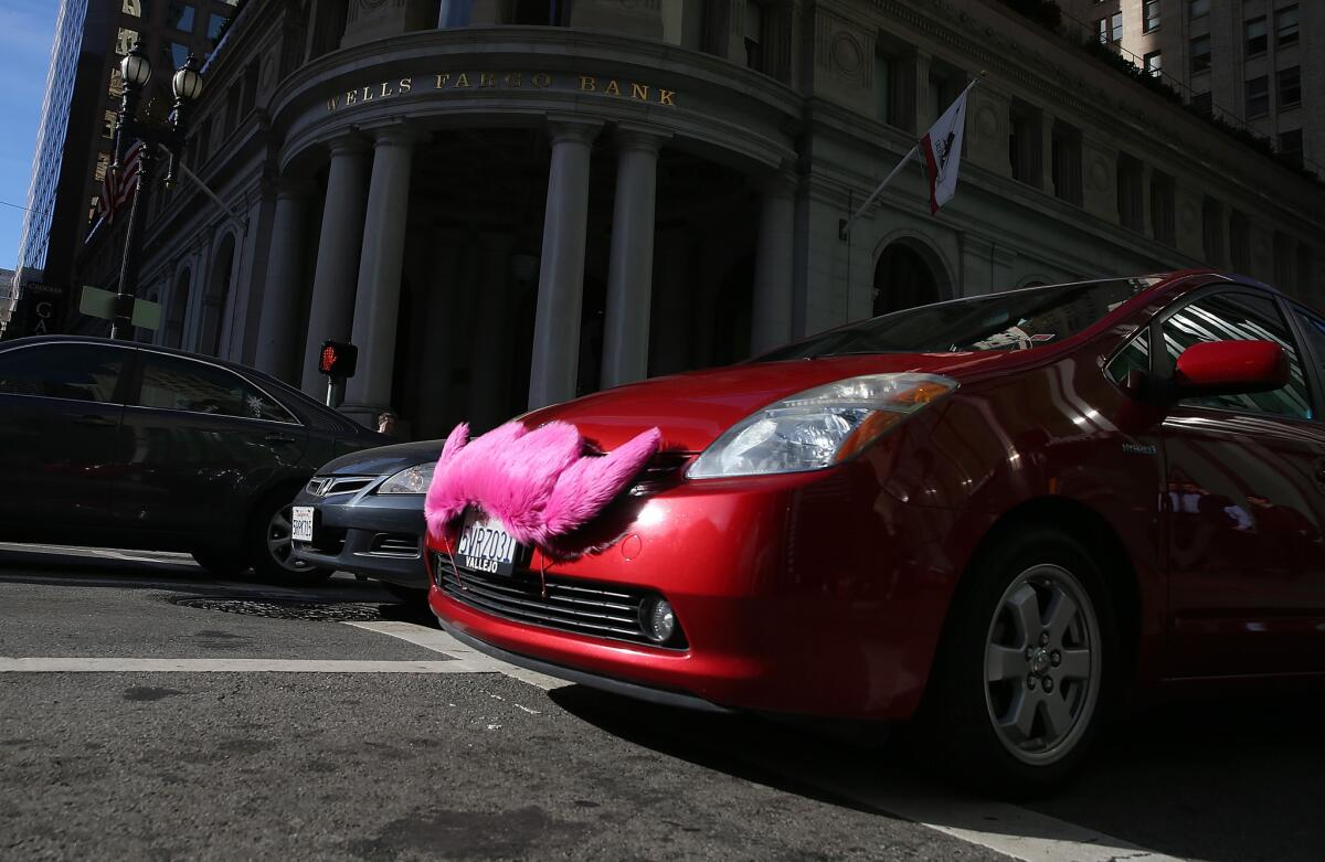A Lyft car drives along Montgomery Street in San Francisco.