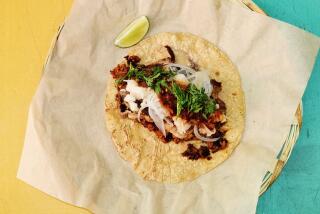 An overhead of the Taco Sonia at restaurant and molino Komal, filled with beef shoulder and chorizo.