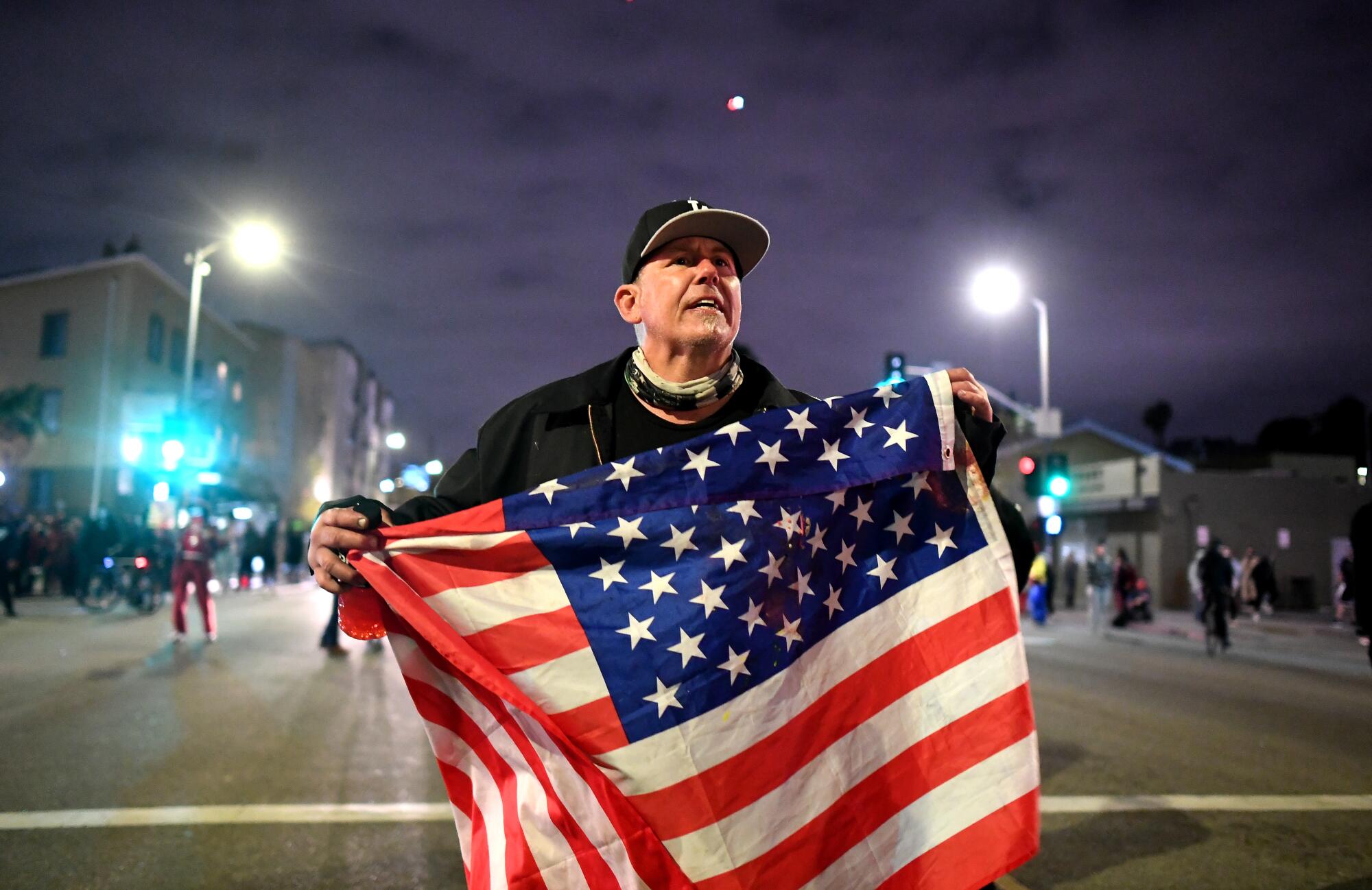 A protester carries a flag. 