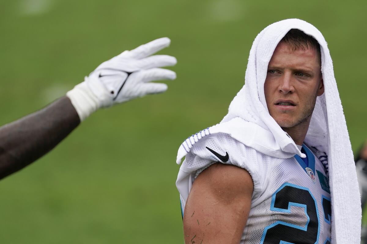 Carolina Panthers' Christian Mccaffrey watches during the NFL football team's training camp in Gibbs Stadium at Wofford College on Saturday, July 30, 2022, in Spartanburg, S.C. (AP Photo/Chris Carlson)