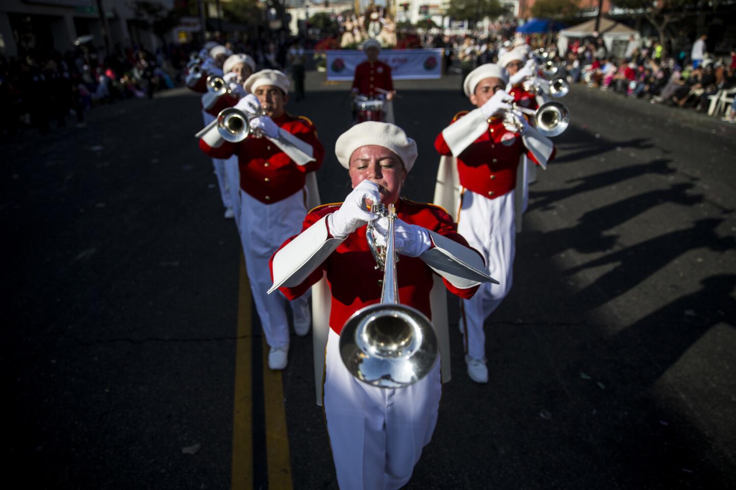 The Pasadena City College Tournament of Roses Herald Trumpets march in formation during the 2018 Rose Parade in Pasadena
