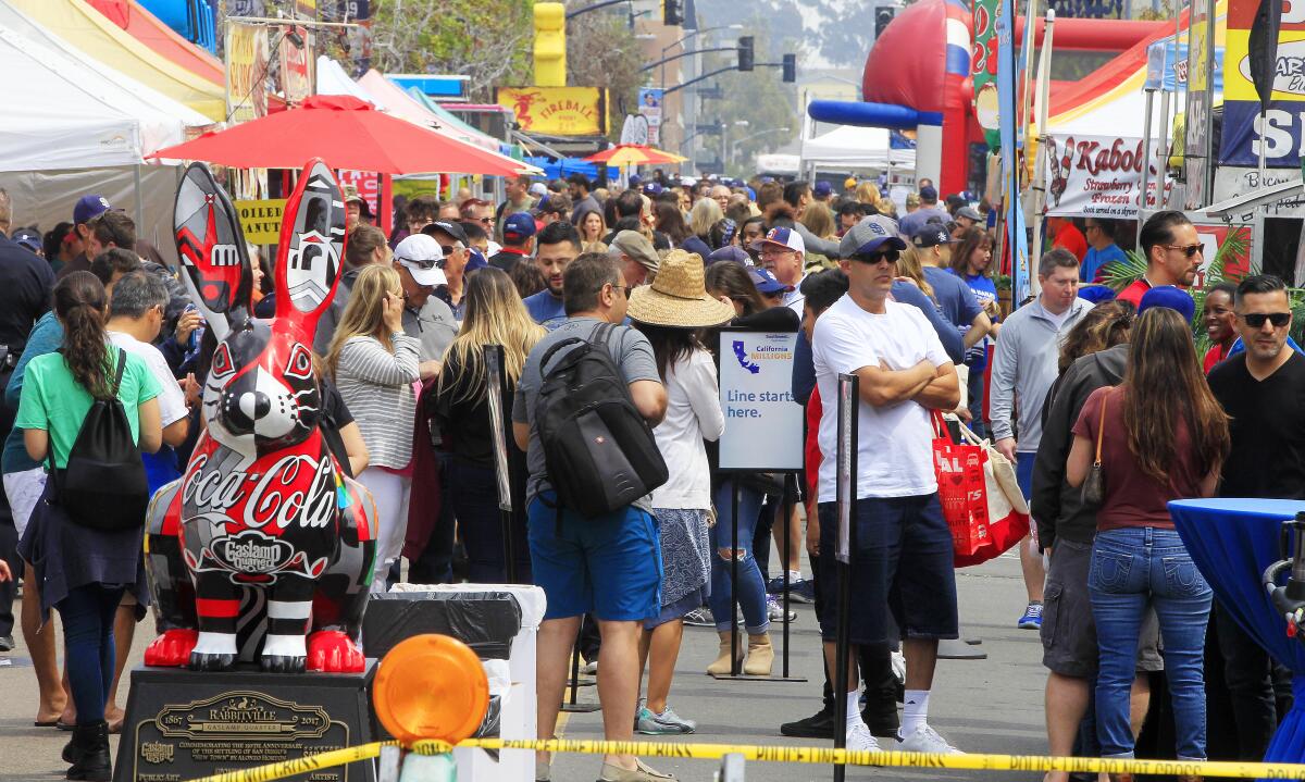 Crowds gather at the annual East Village Opening Day Weekend Block Party in San Diego.