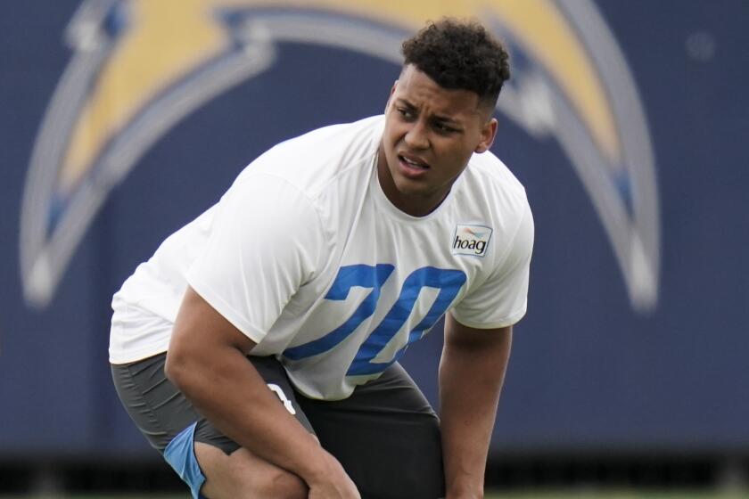 Chargers offensive tackle Rashawn Slater participates in a drill 