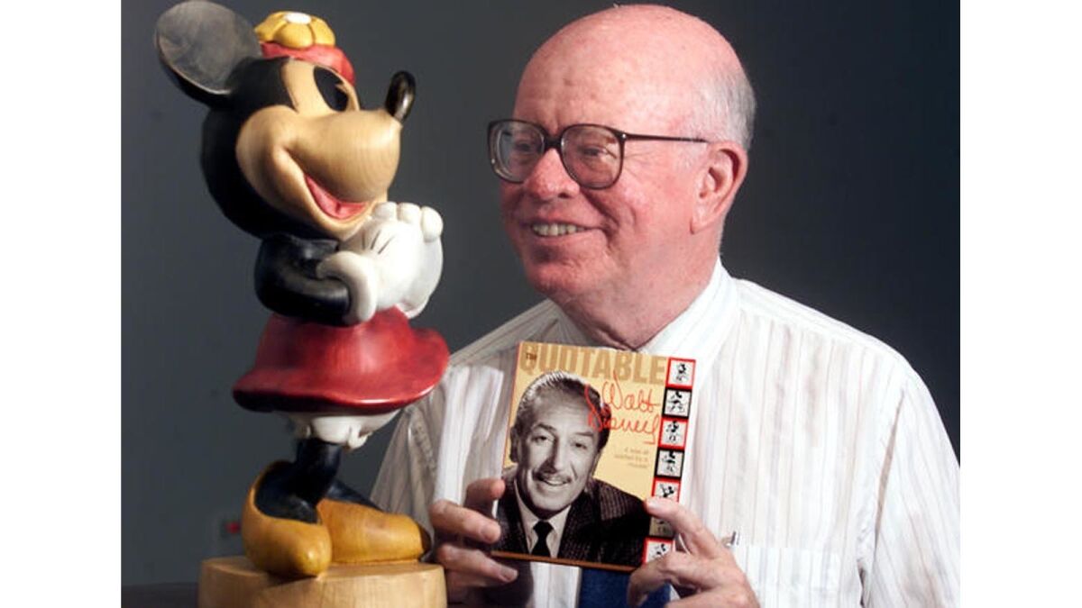 Dave Smith holds a collection of Walt Disney sayings.