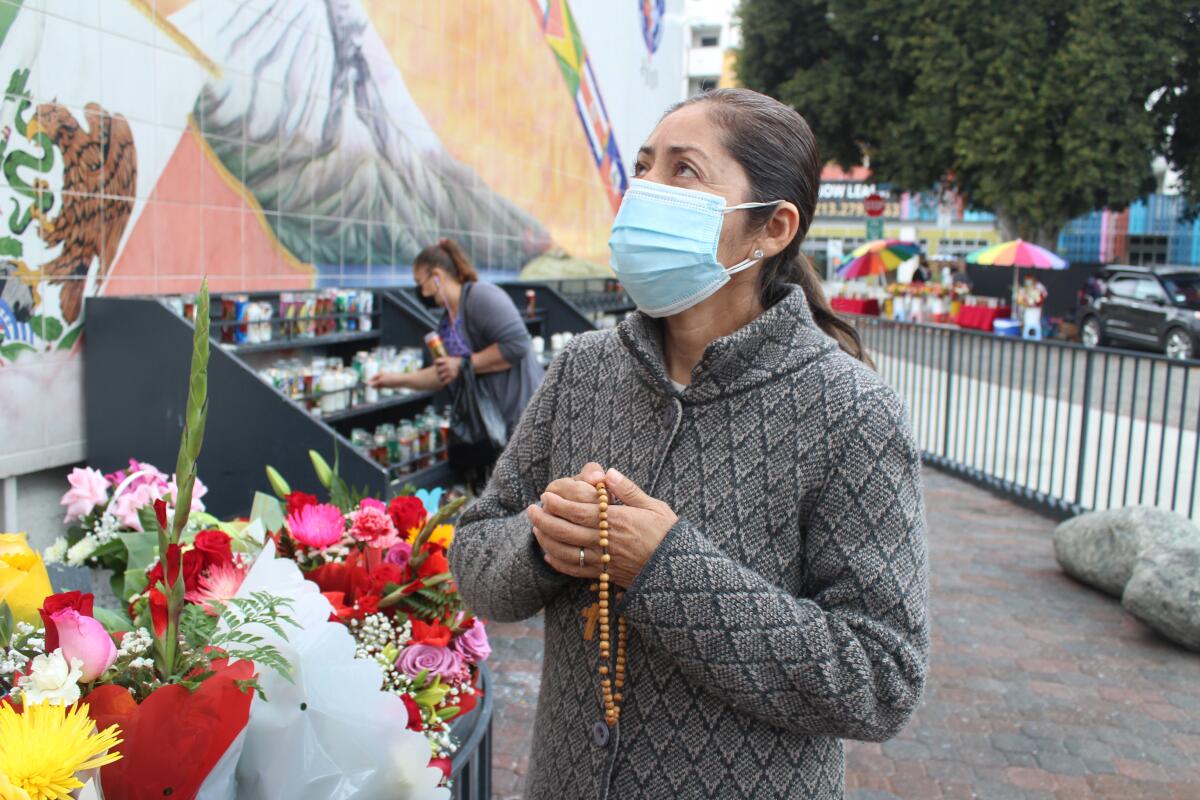 Rosalía González visited Olvera Street and prayed before the Virgen de Guadalupe with native Mexican San Juan Diego.