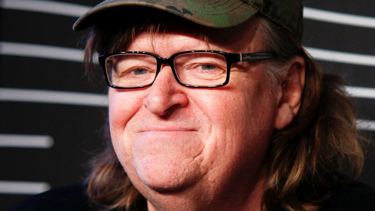 Documentarian Michael Moore is working on a secret anti-Trump movie.