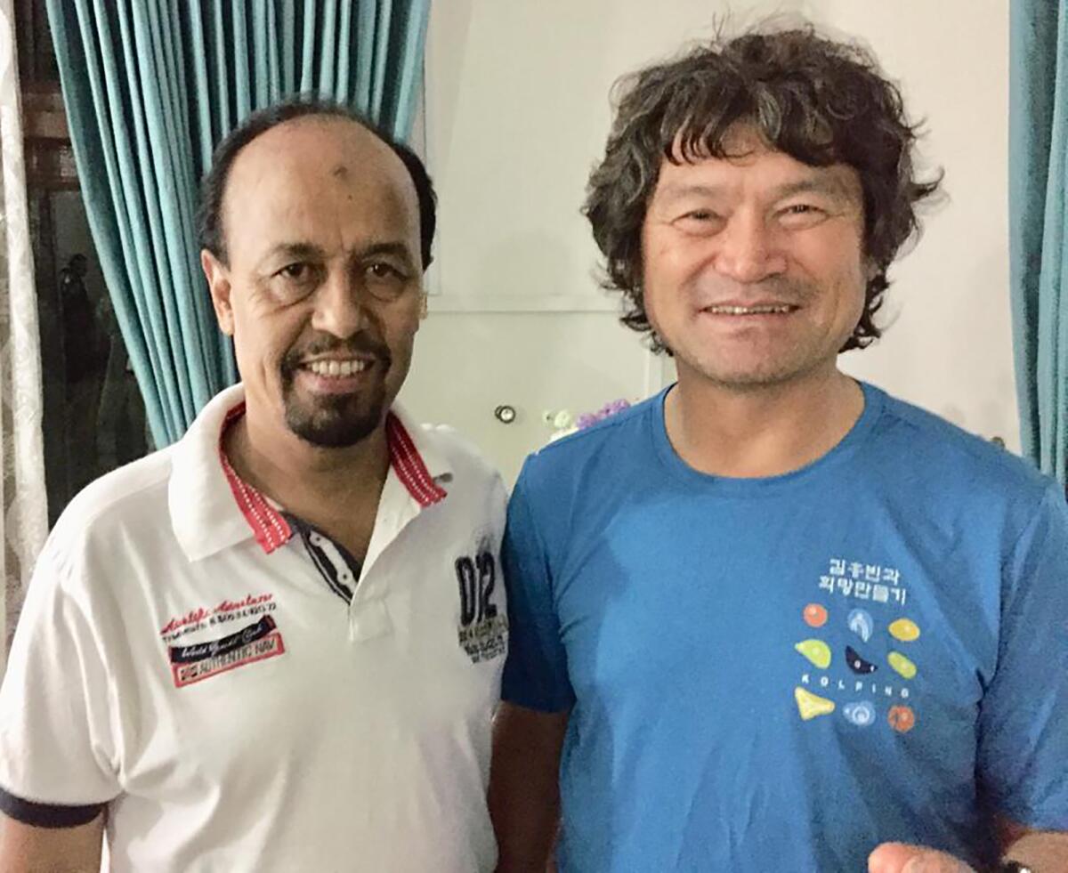 Pakistan Alpine Club's Karrar Haidri with South Korean climber Kim Hong Bin