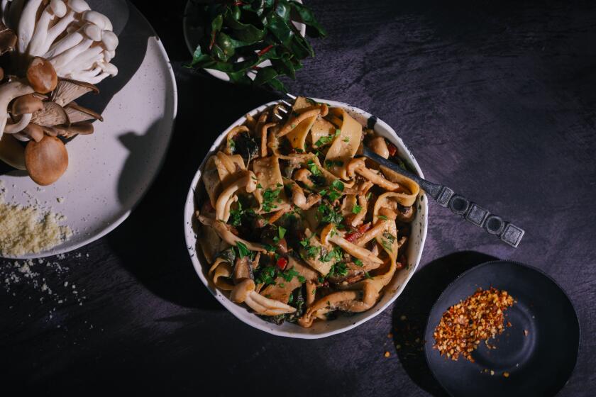 LOS ANGELES, CA - JANUARY 20, 2023: A bowl of mushroom pasta sits on a textured tabletop on January 20, 2023 at the Los Angeles Times test kitchen in El Segundo, CA. The mushroom pasta is a featured recipe.