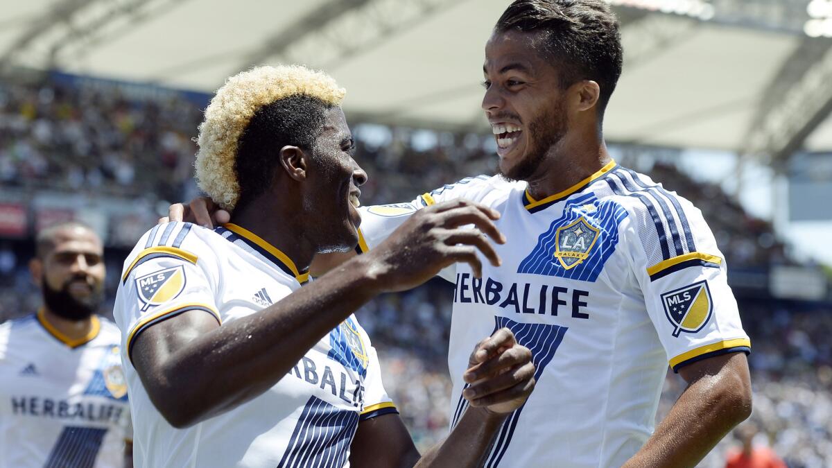 Gyasi Zardes, 25, and 27-year-old Giovani Dos Santos, right, are fast becoming the "old men" on the Galaxy, who have become one of the youngest teams in the MLS.