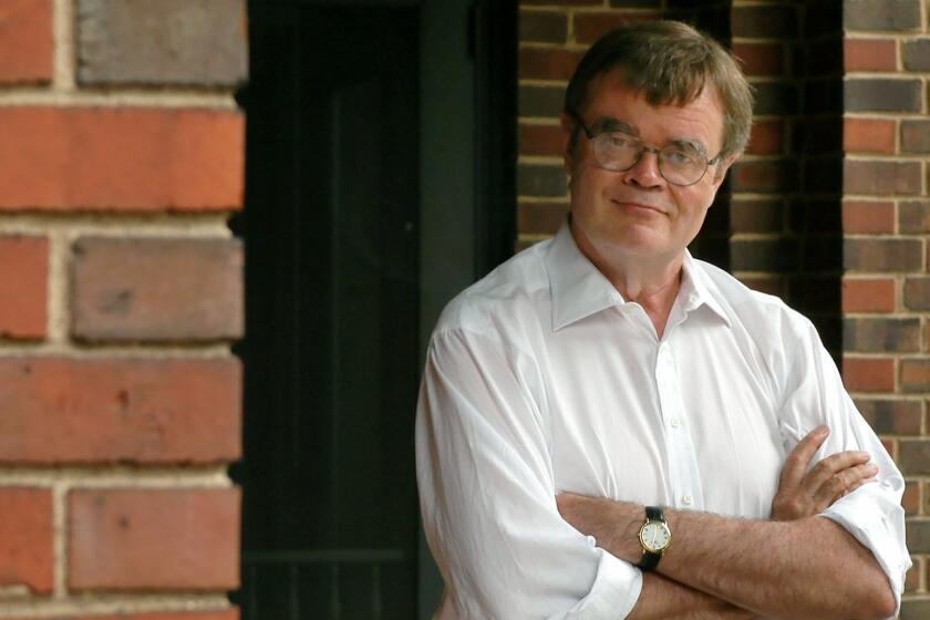 ** FILE ** Writer Garrison Keillor poses in fron of his St. Paul, Minn., home in this Aug. 5, 2003 file photo. (AP Photo/Ann Heisenfelt) ORG XMIT: MNAH103