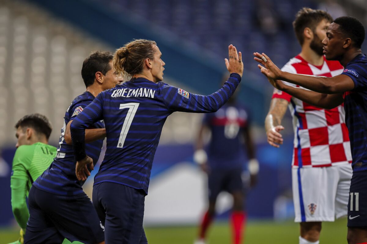 France's Antoine Griezmann celebrates after scoring his first goal during a UEFA Nations League soccer match against Croatia at the Stade de France stadium in Saint-Denis, north of Paris, France, Tuesday, Sept. 8, 2020. (AP Photo/Francois Mori)