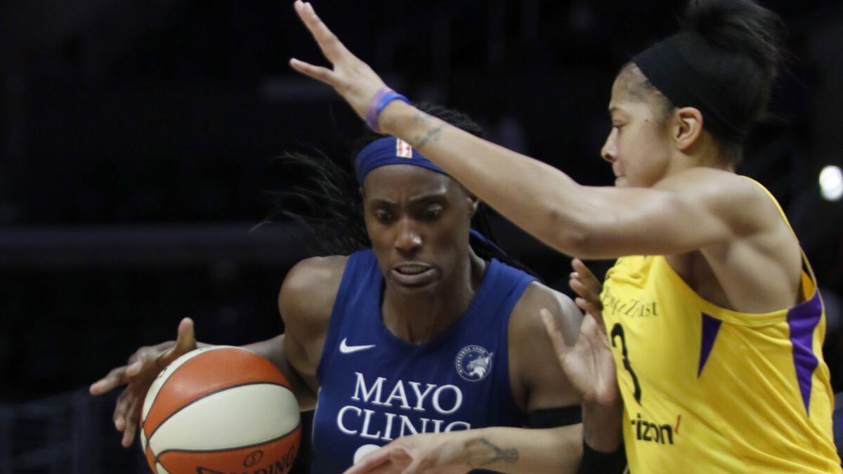Sparks center Candace Parker defends against Minnesota Lynx center Sylvia Fowles in the fourth quarter of an WNBA playoff game at Staples Center on Tuesday.