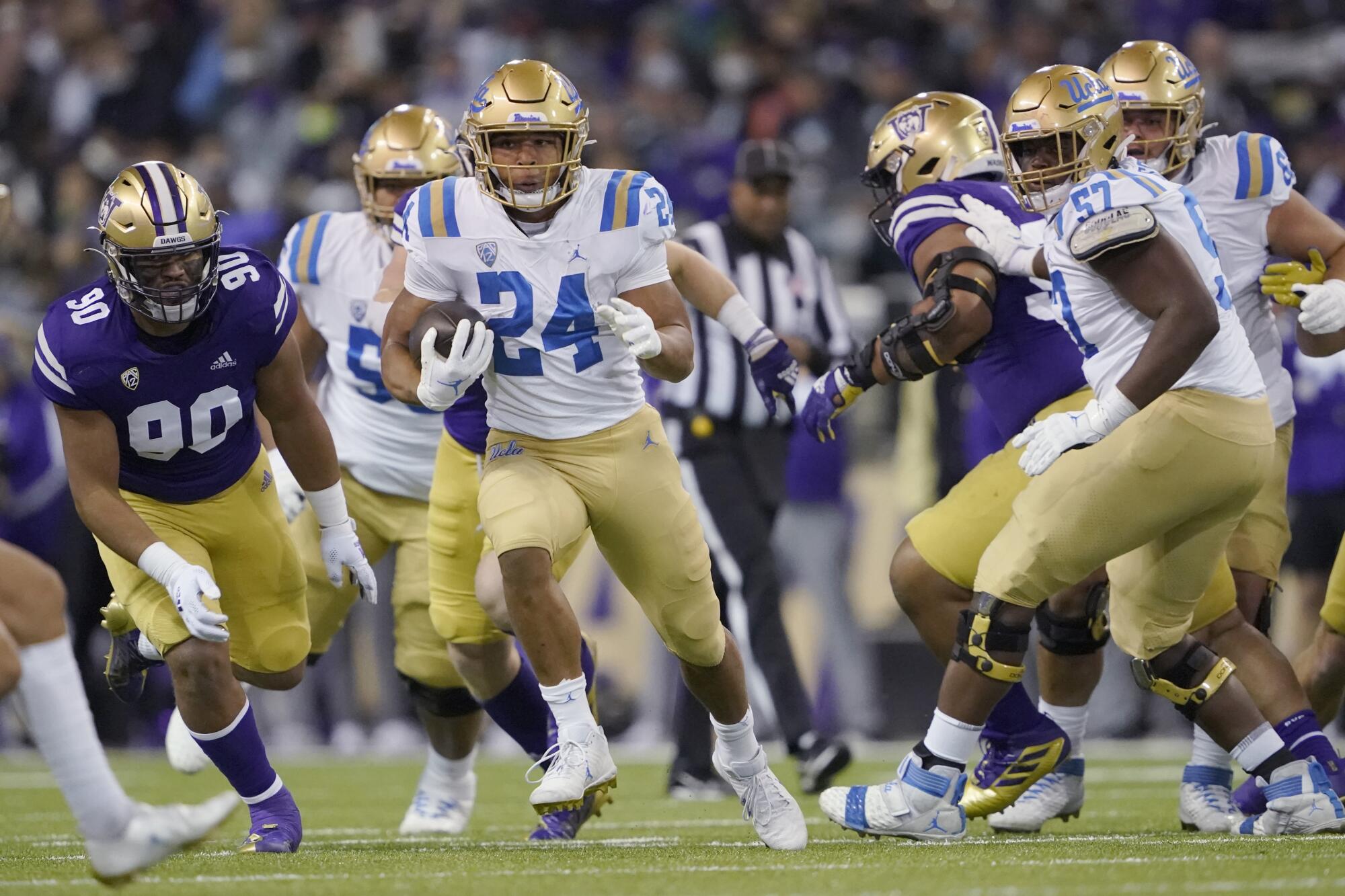 UCLA running back Zach Charbonnet (24) carries the ball against Washington Saturday