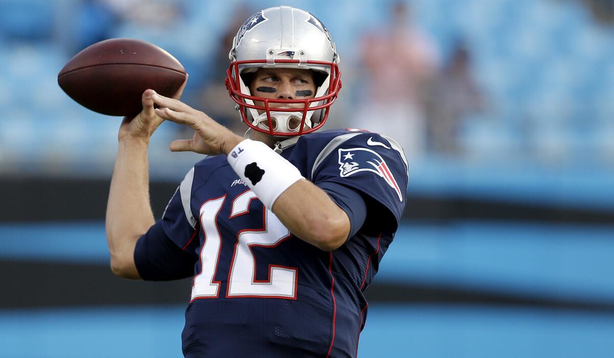 New England Patriots' Tom Brady tosses a pass before a preseason NFL football game against the Carolina Panthers on Aug. 28.