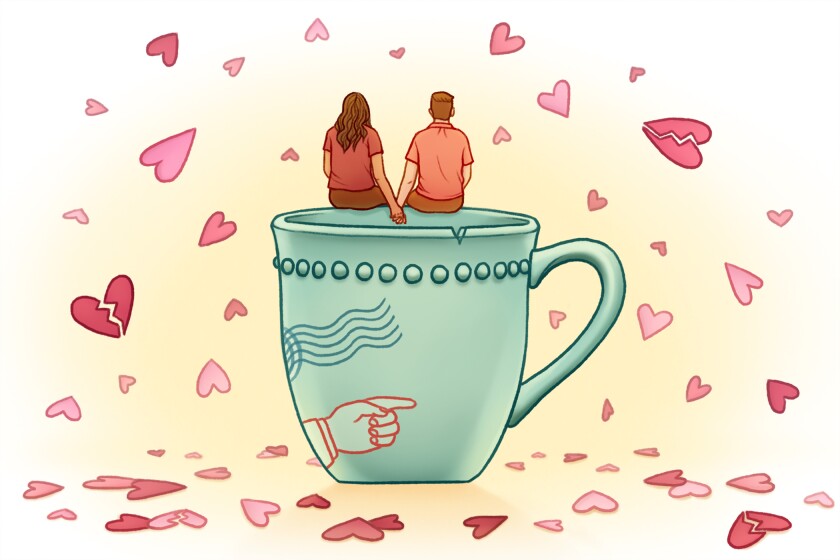 Couple sitting on a chipped coffee mug.