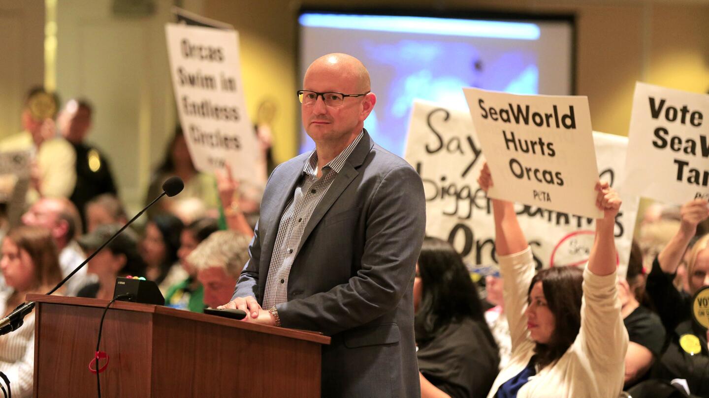 SeaWorld park President John Riley speak about the care of orcas during a meeting of the California Coastal Commission in Long Beach on on Thursday.