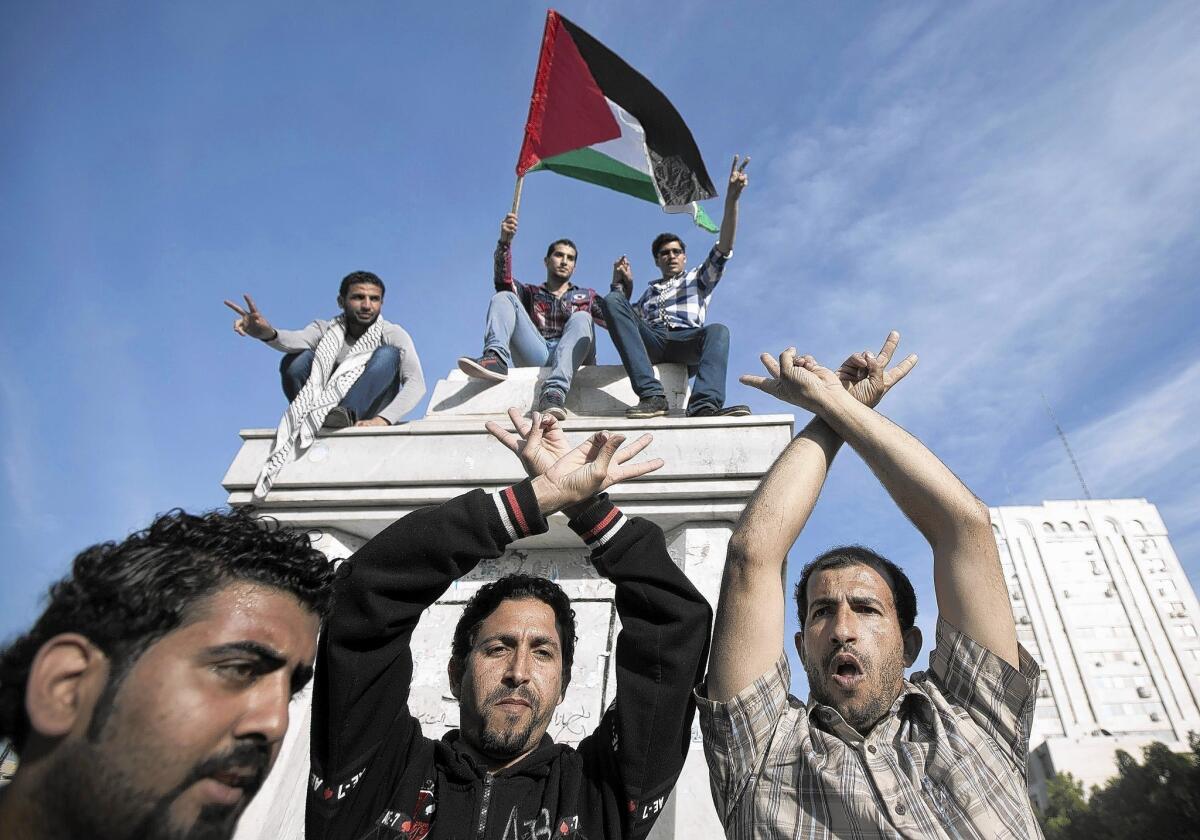 Palestinians in Gaza City celebrate the agreement to form a unity government.
