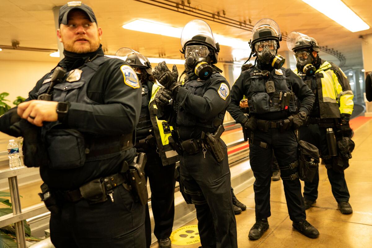 Police arrive at the Capitol on Jan. 6, 2021, to quell the violent mob.